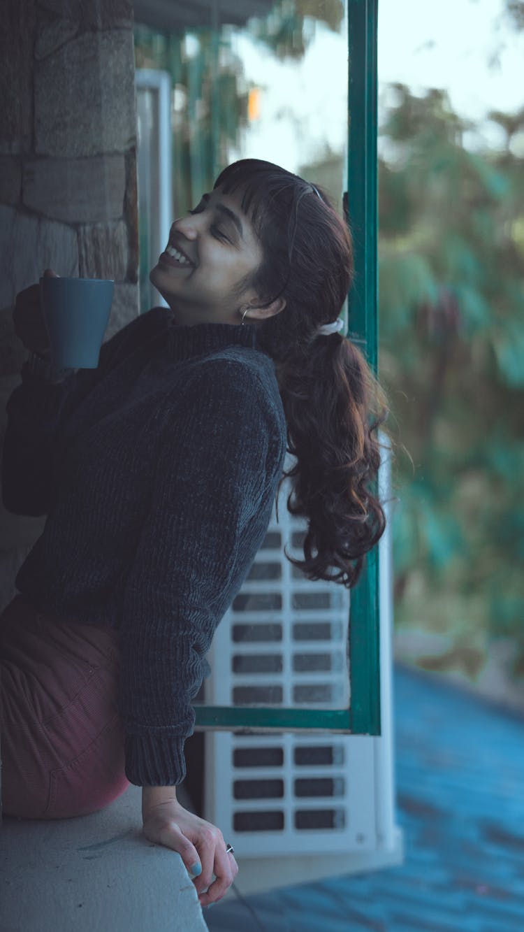 Brunette Woman Relaxing And Drinking Coffee