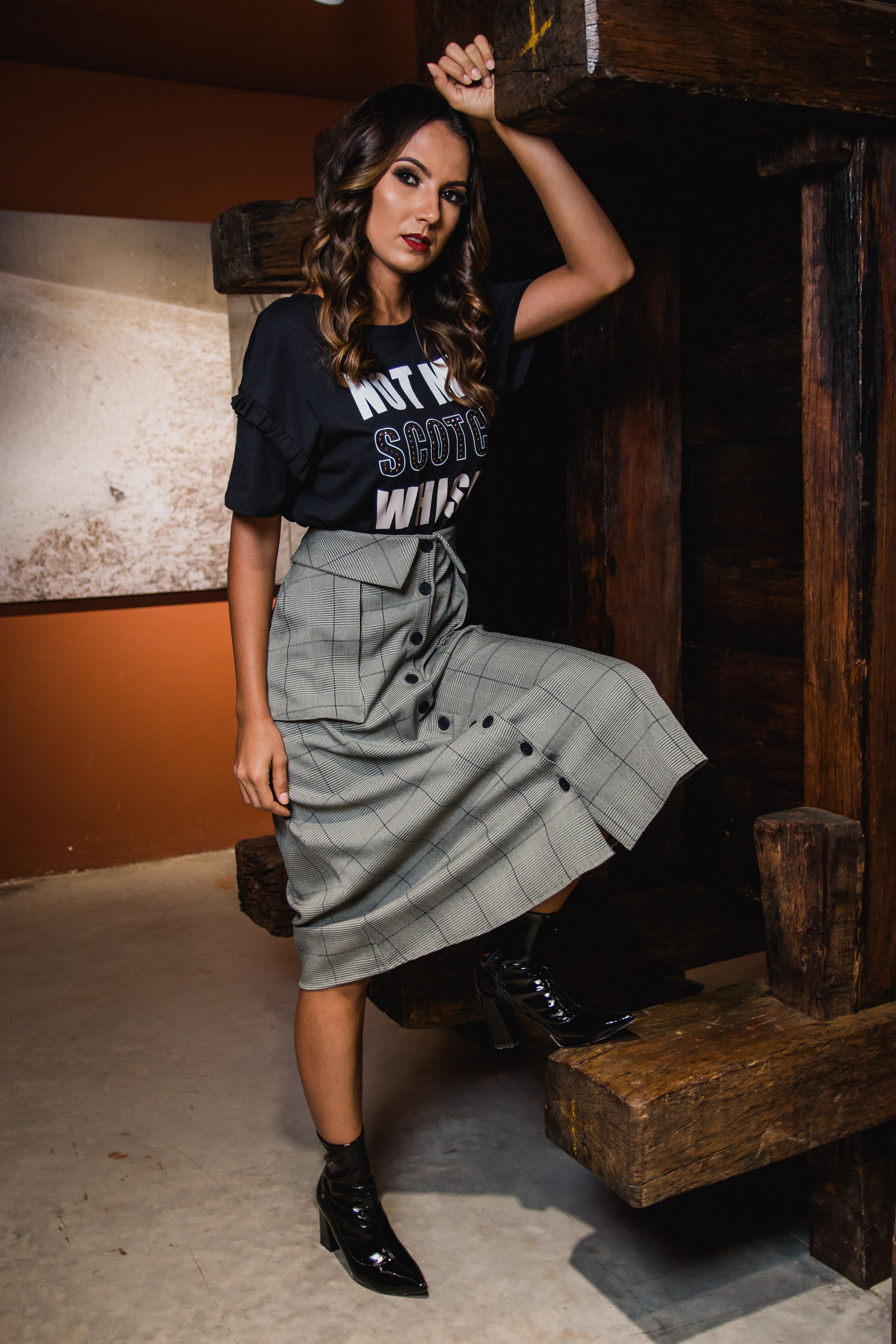 A pleated tartan skirt showing pleat depth and hemline for a skirt tech pack