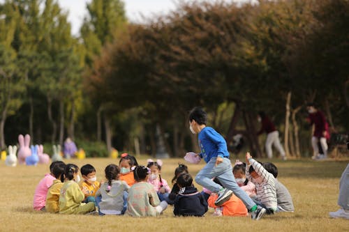 Kids Wearing Face Masks Playing Outside