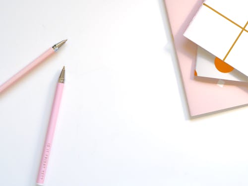 Free Two Pink Ballpoint Pens on Table Stock Photo