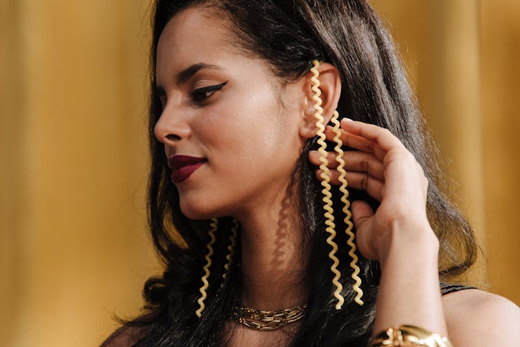 Beautiful Woman Showing Jewelry On Her Ear