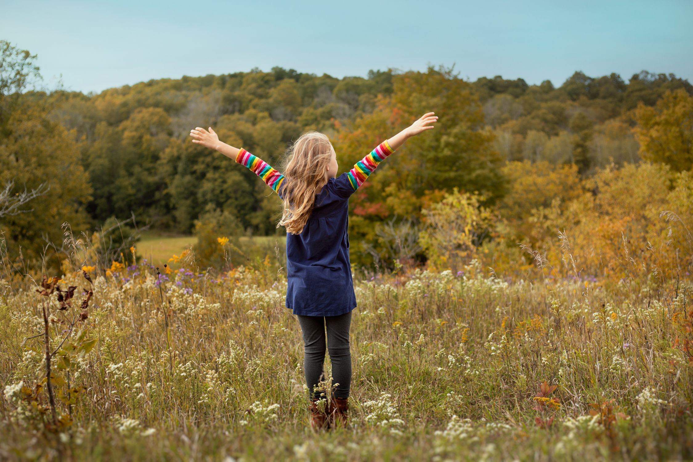 A Girl Standing on the Green Grass Field · Free Stock Photo