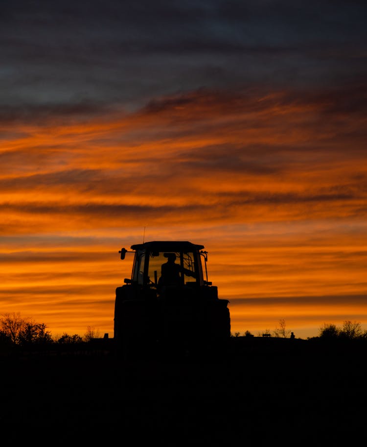 A Tractor At Dusk