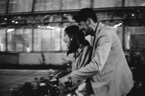 Free Monochrome Photo of a Couple Riding a Bicycle Stock Photo