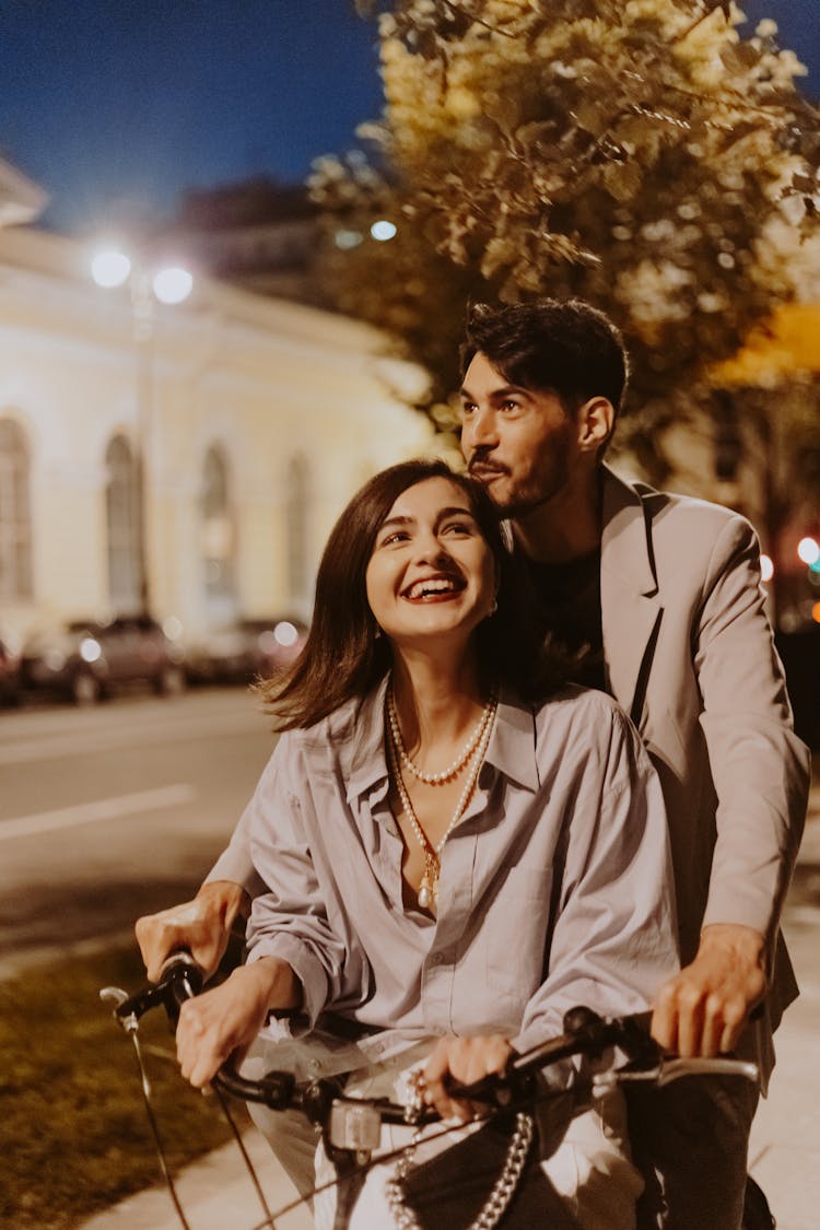 A Couple Enjoying Riding Bicycle