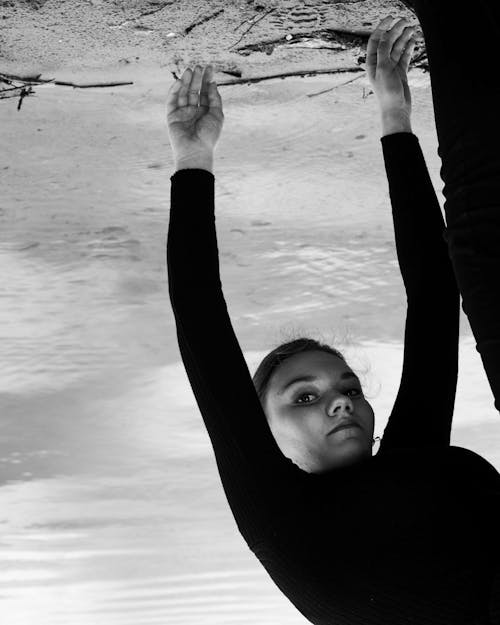 Grayscale Photo of Woman in Black Long Sleeves