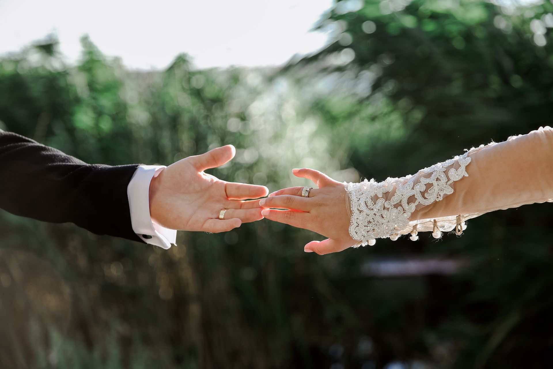 Womans and Mans Hands Touching together in Wedding Clothes