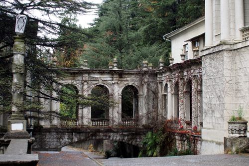Free Explore the detailed architecture of an abandoned sanatorium in Sochi, amidst lush greenery. Stock Photo