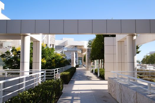 A scenic view of the modern architecture at the Getty Center plaza with lush greenery.