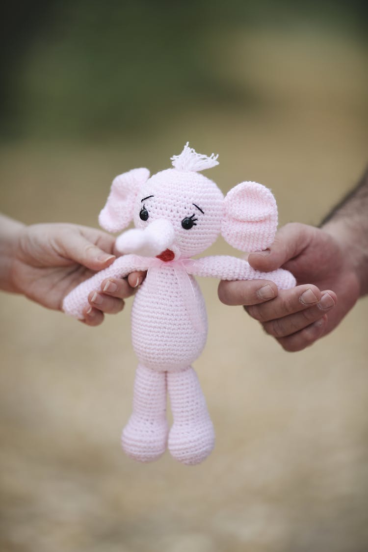 Close Up On Man And Woman Holding Toy