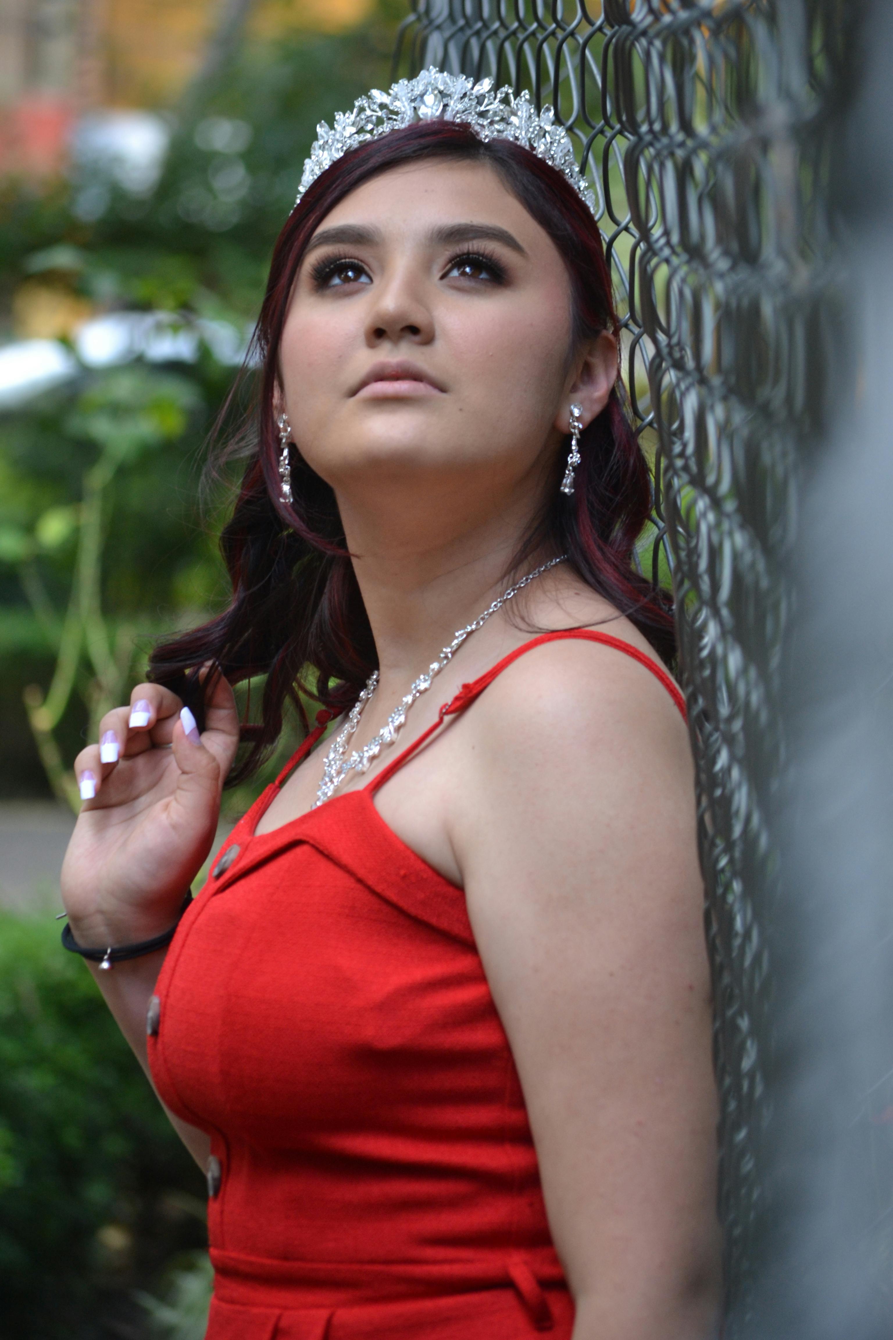 young woman in red dress with tiara