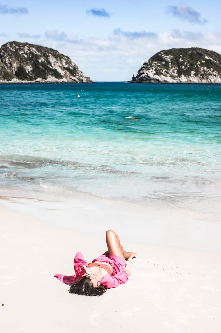 Woman Lying On A Tropical Beach 