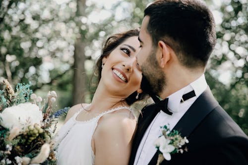 Free Close-up Photo of Bride and Groom looking at each other Stock Photo