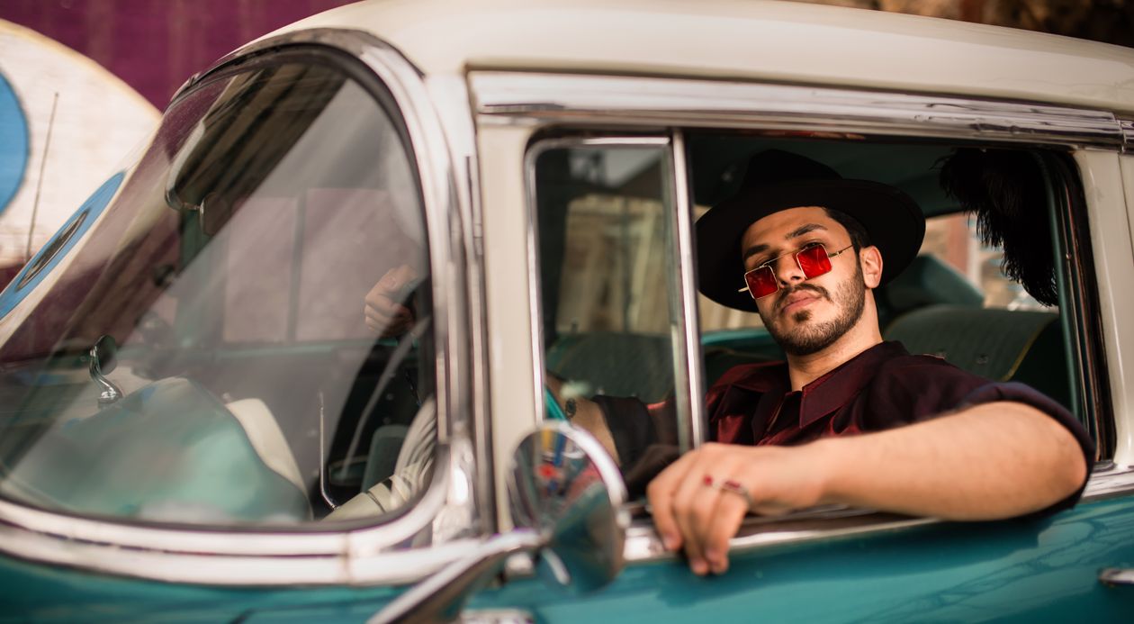 A Man in Black Hat and Sunglasses Sitting Inside the Car · Free Stock Photo
