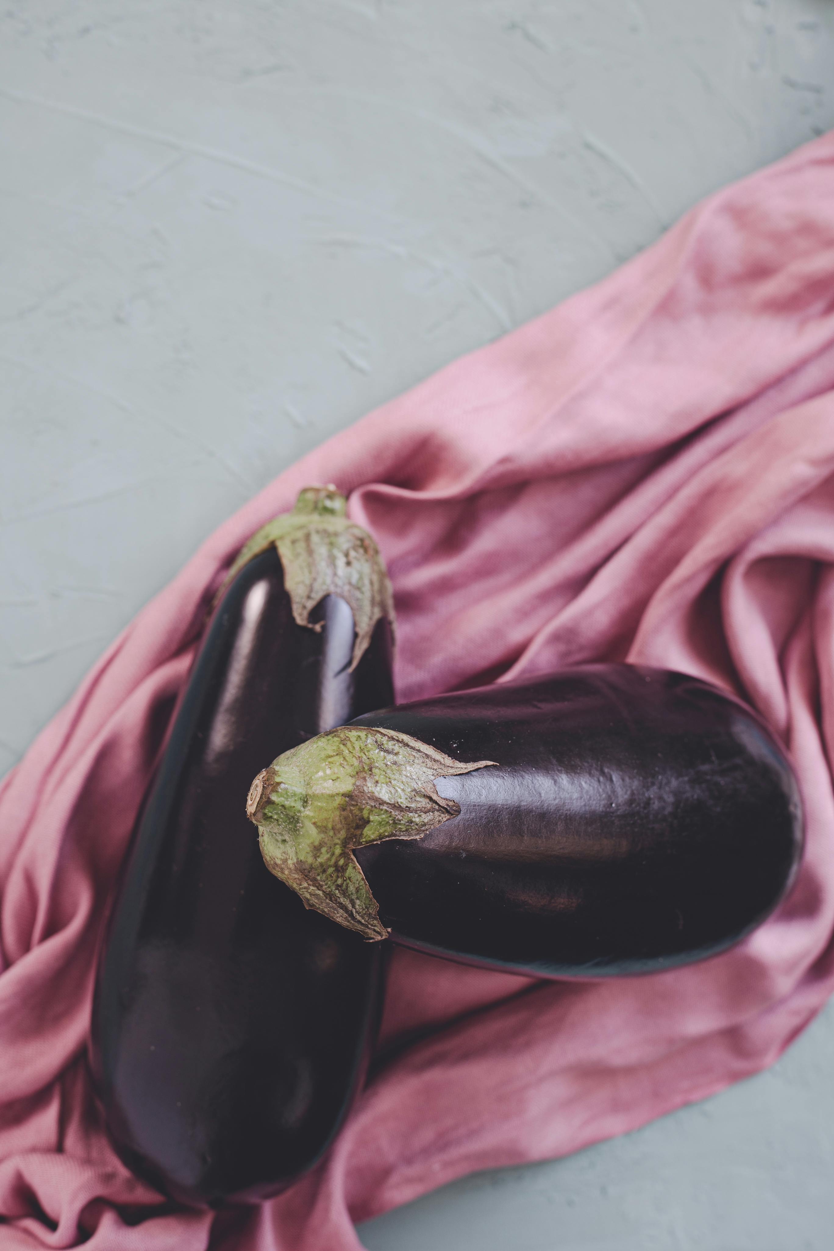 Two Eggplants on Pink Shirt · Free Stock Photo