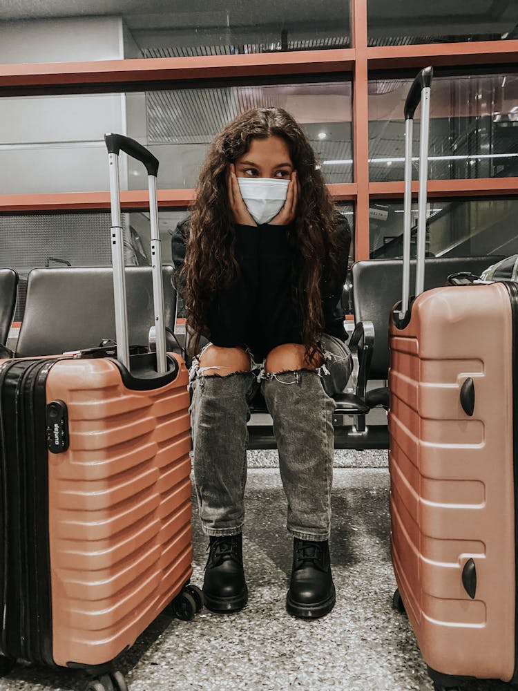 Woman With Face Mask Waiting In The Airport