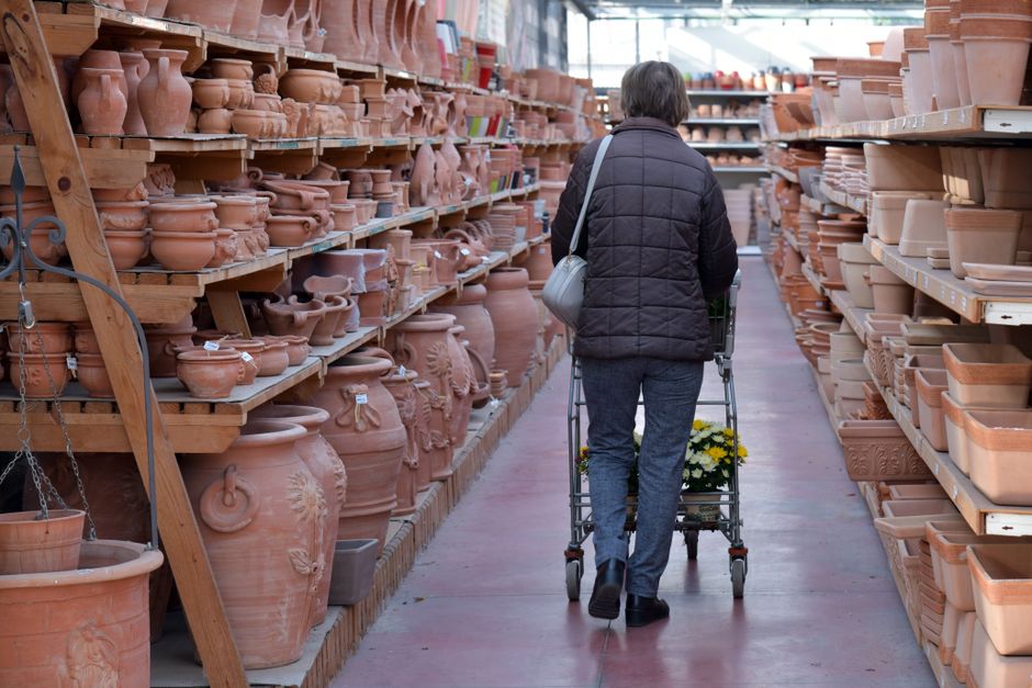 A woman shops for terracotta pots in a pottery store in Rizza, Italy.