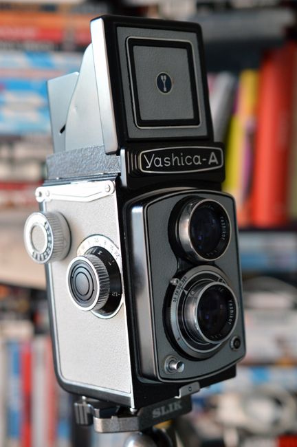 Close-up of a classic vintage Yashica-A camera, showcasing its unique dual lens design.