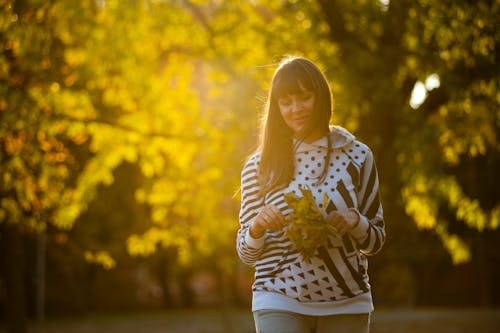 Woman Holding Leaves