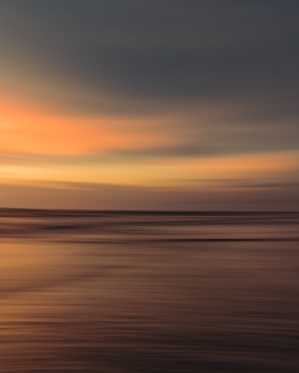 Free A Blurred Photo of a Sunset Stock Photo