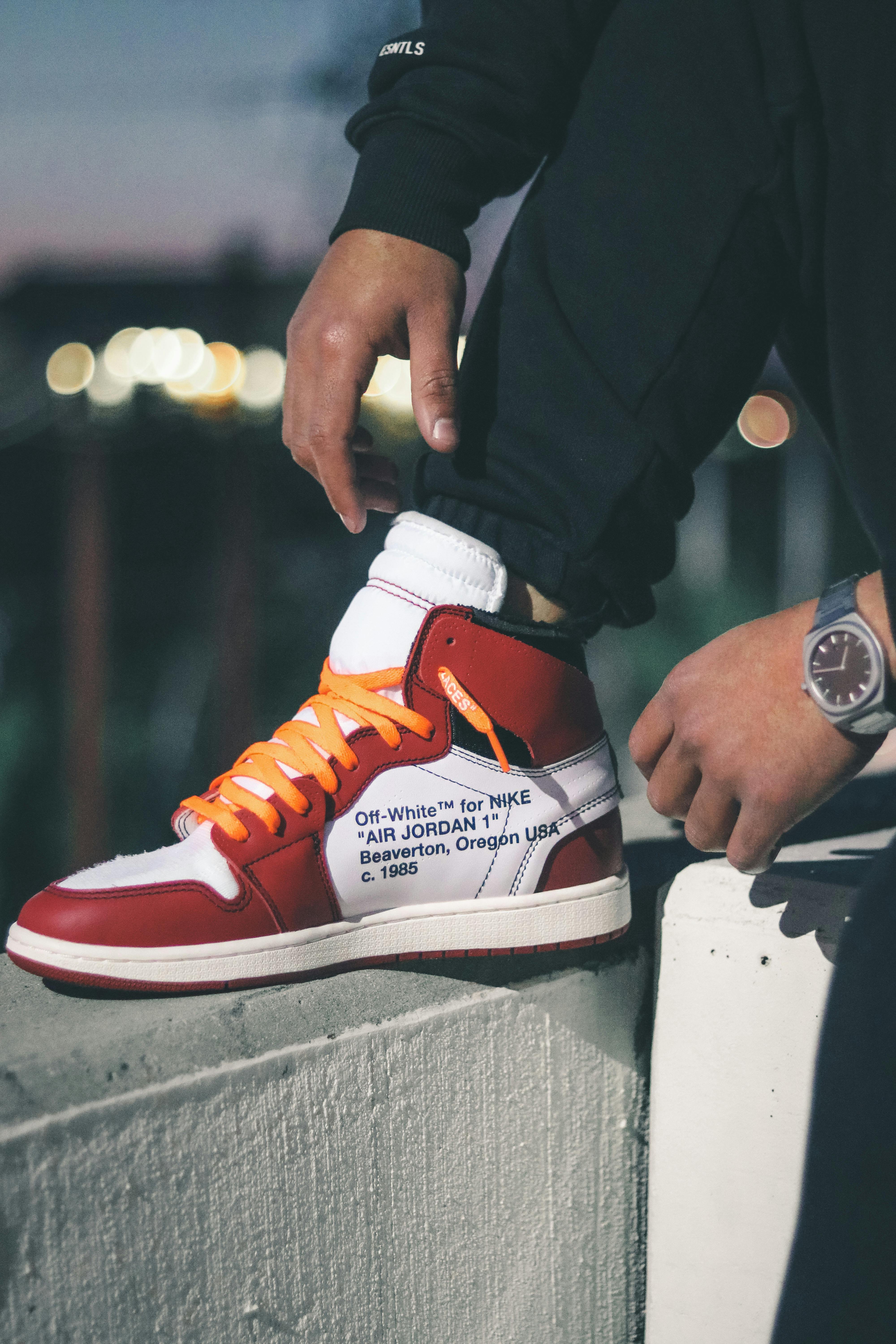 Close-up off white red jordan 1 of a Person Wearing Off-White x Air Jordan 1 Retro High