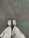Person in Gray Pants and Orange Rubber Clogs