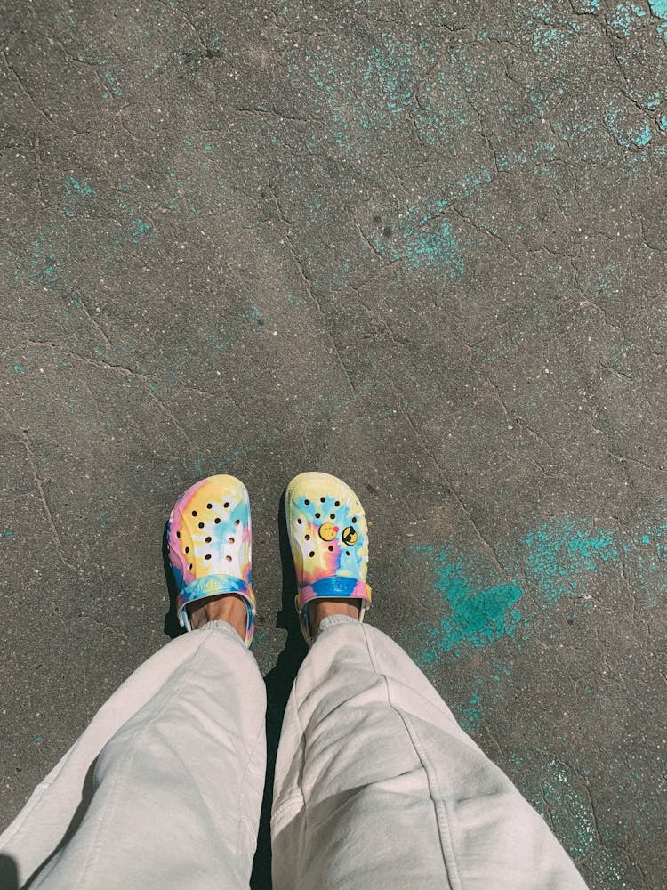 Person In Gray Pants And Rubber Clogs