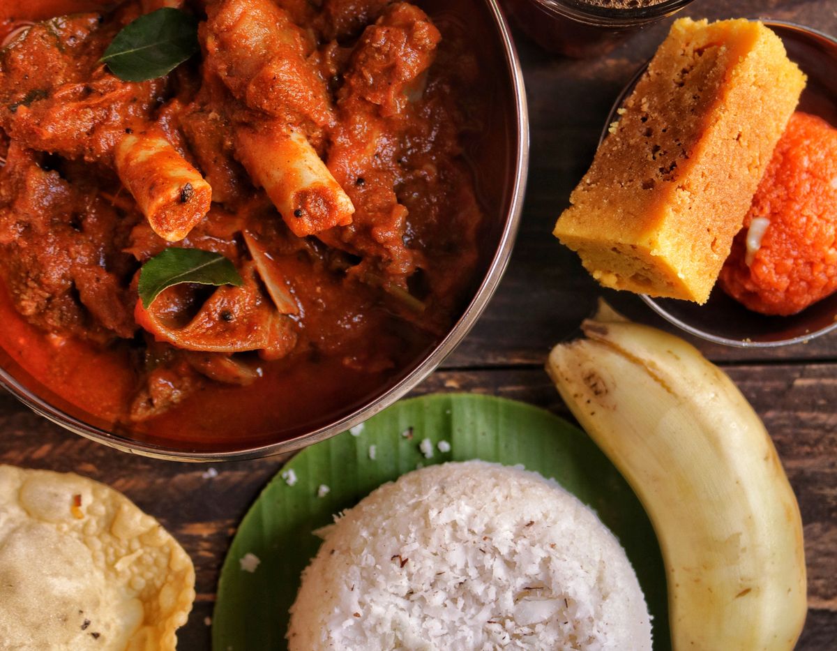 Traditional South Indian meal with rice, curry and snacks