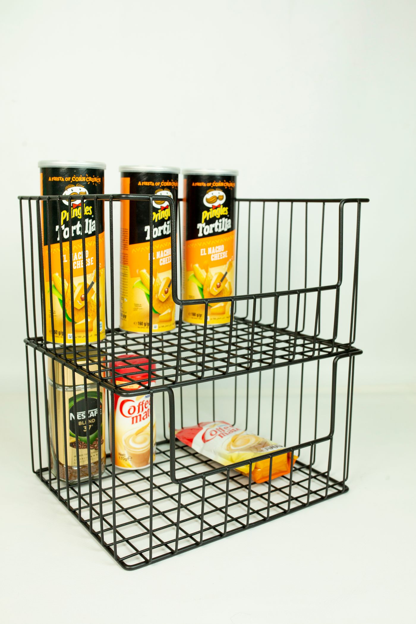 Organized home pantry with storage baskets and household supplies arranged on shelves