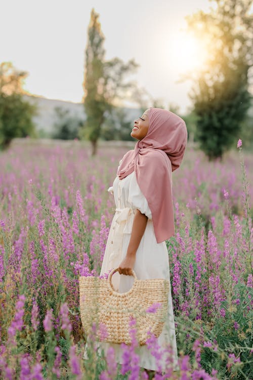 Woman with Bag in Meadow