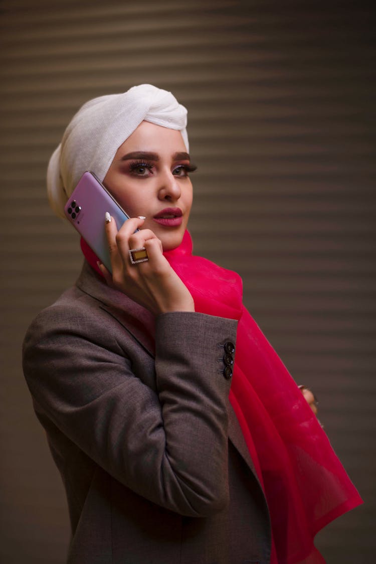 Woman In Headscarf Talking Through Phone