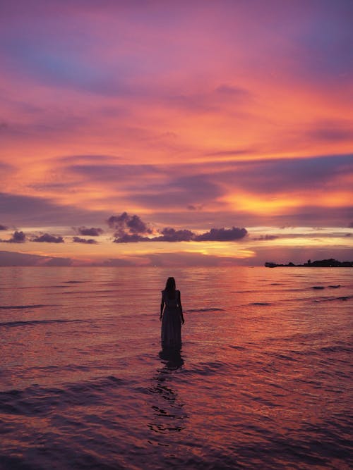 A Person on the Beach During Sunset