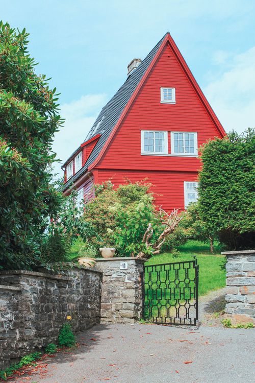 Free Charming red house with garden, traditional architecture, outdoors in Bergen, Norway. Stock Photo