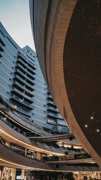Low angle view showcasing the sleek and modern design of İstanbul's Kanyon Shopping Mall.