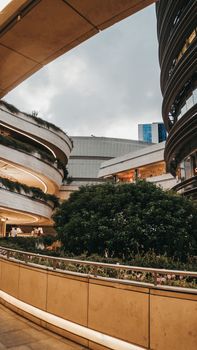 Elegant modern architecture of a shopping mall in Istanbul, Turkey, showcasing curvilinear design and greenery.