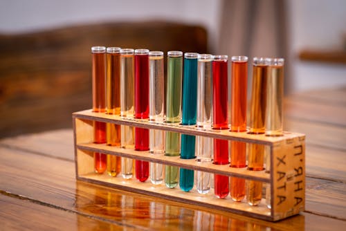 Free A Test Tube Rack with Glass Items on a Wooden Table Stock Photo