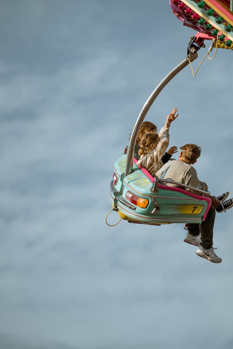 People Riding An Amusement Ride