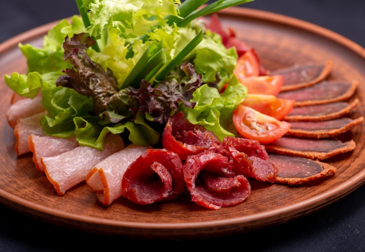 Sliced Meats And Salad On A Plate