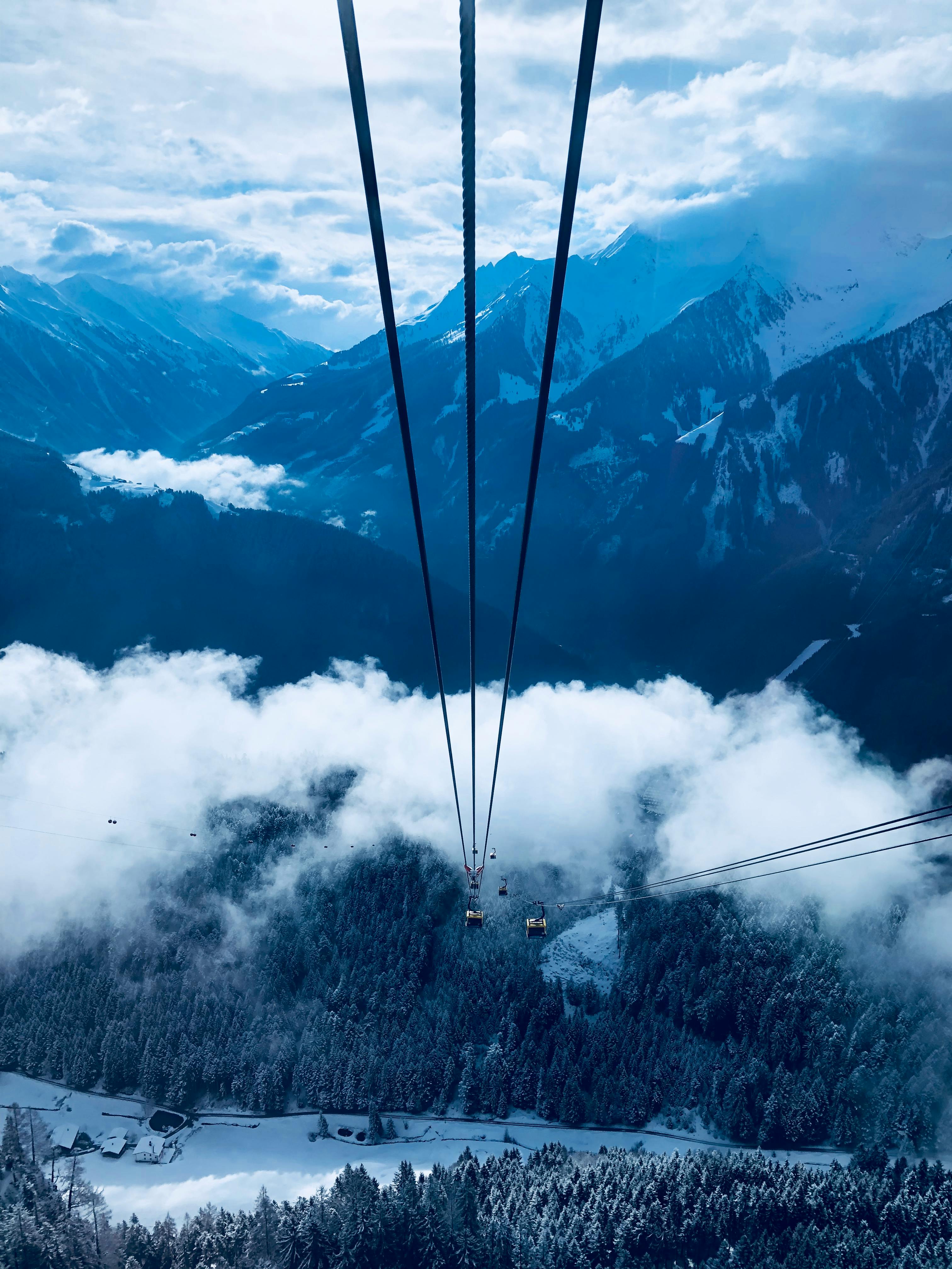 cable car under white clouds