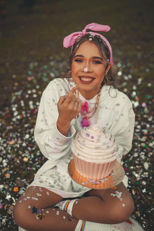 Free Woman Holding a Giant Cupcake Stock Photo