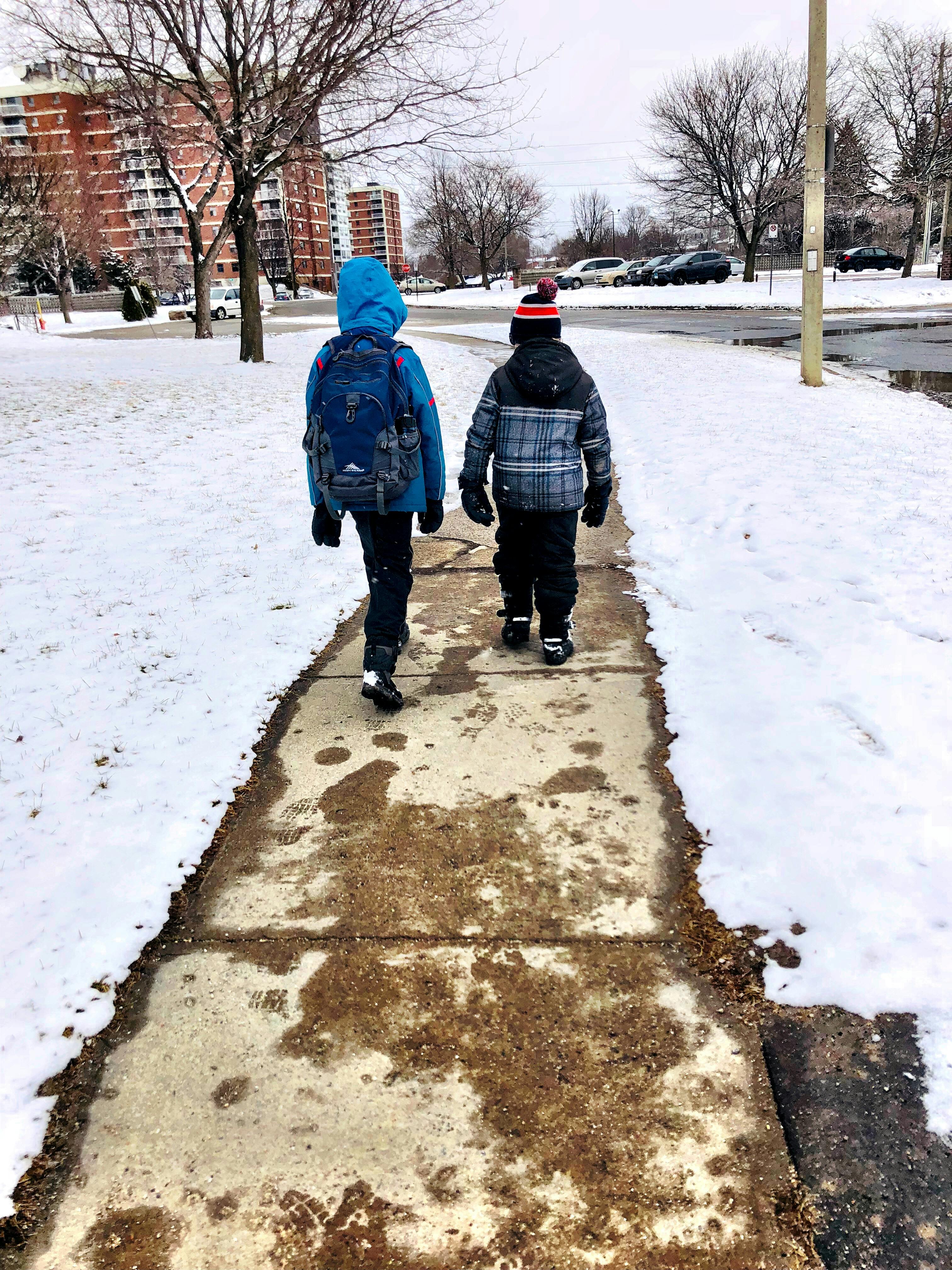 Free stock photo of #walking #snow #sidewalk #backpack #kids #two