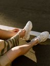 Close up on Womans Legs on Car Park