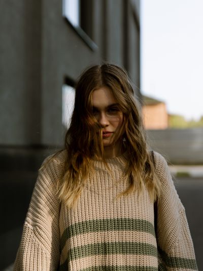 Oversized striped knit jumper — photo by Vladimir Gladkov on Pexels
