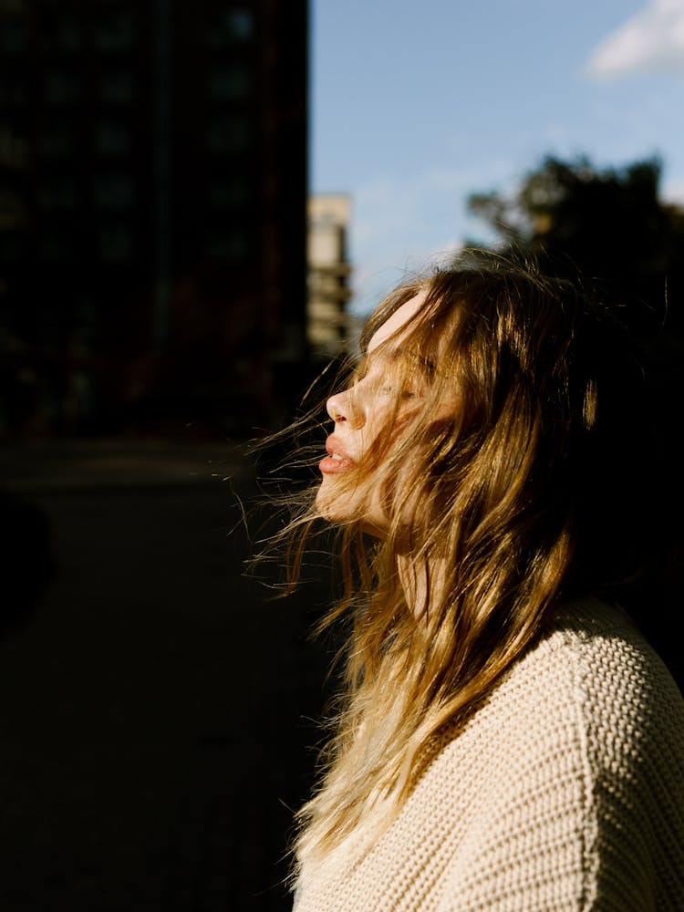 Blonde Woman With Closed Eyes