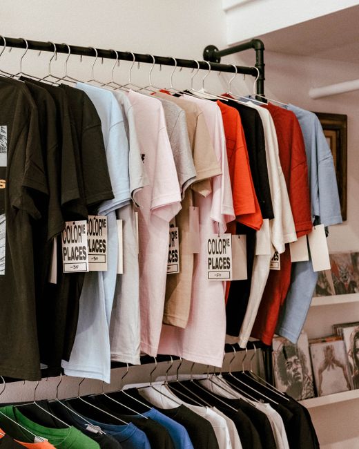 Vibrant arrangement of colored t-shirts in an Orlando boutique. Perfect retail stock image.