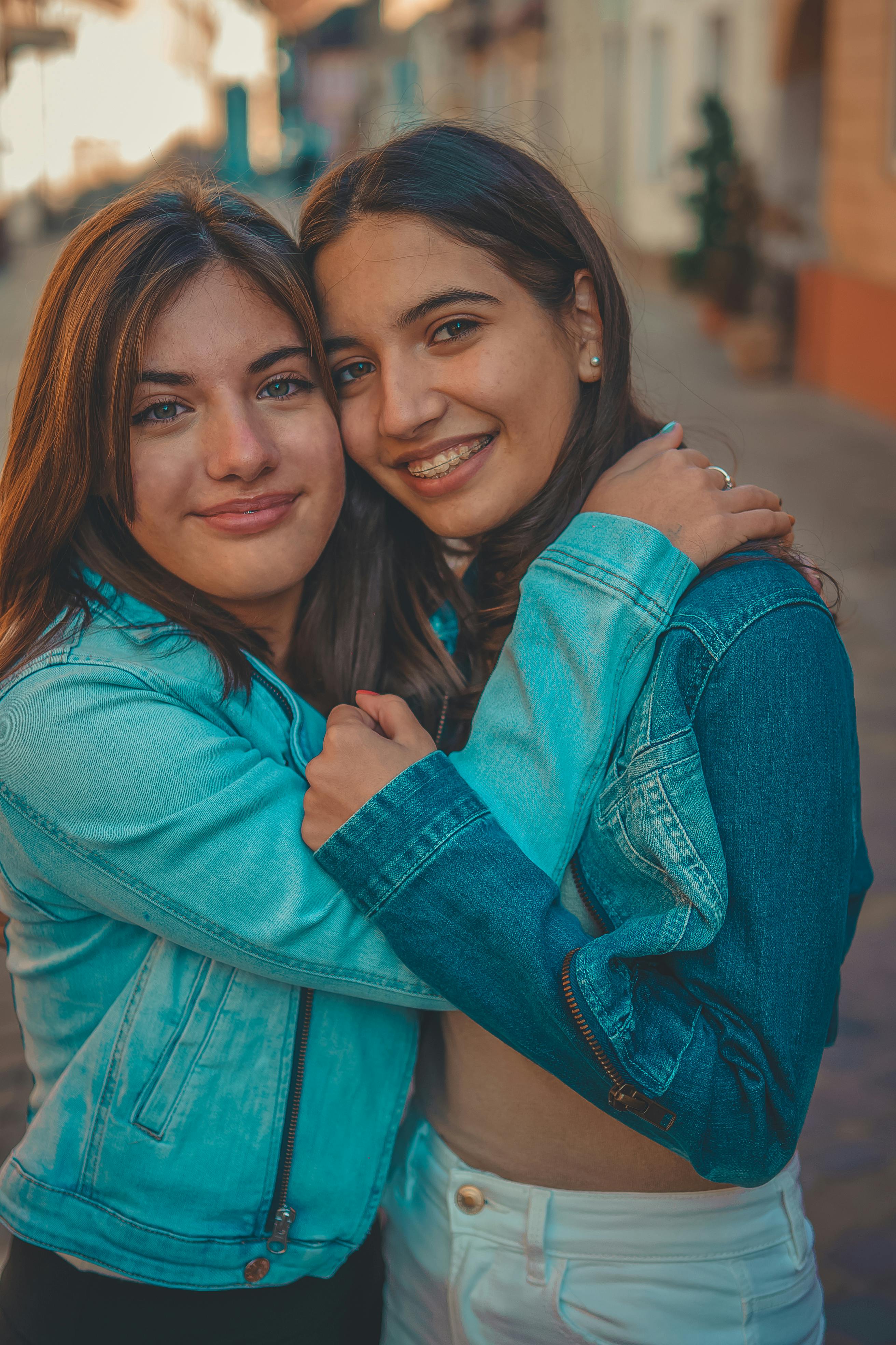 woman-in-blue-denim-jacket-smiling-beside-woman-in-blue-denim-jacket-free-stock-photo