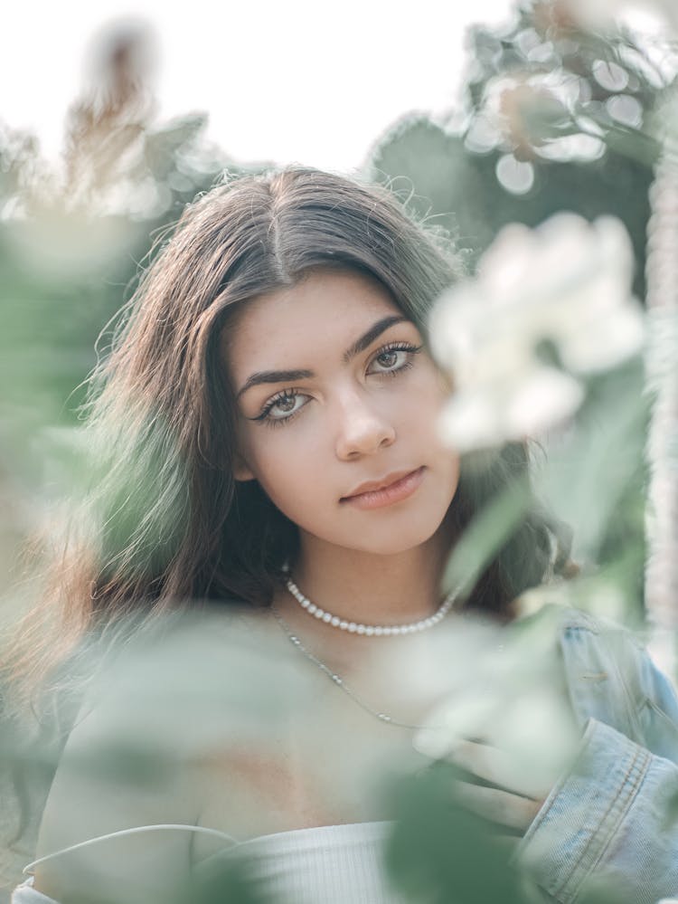 Brunette Wearing Two Necklaces