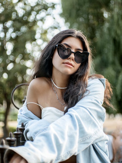 A Beautiful Woman in Denim Jacket Wearing Sunglasses