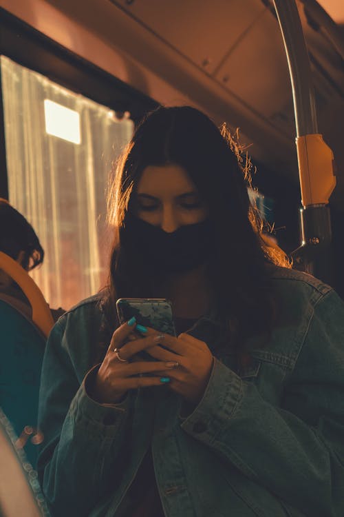 Woman in Bus Wearing Face Mask