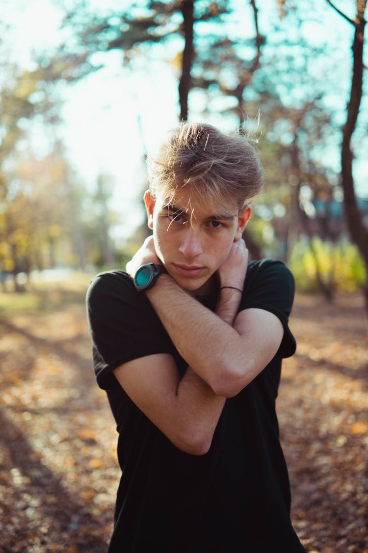 Young Man In Autumn Park